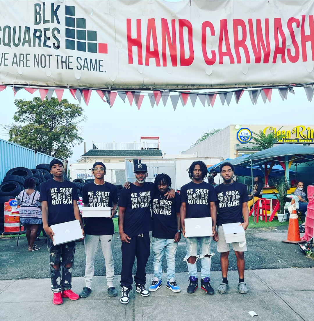 The BLK Squares Auto Spa crew under the BLK Squares Hand Carwash banner in Queens, NY